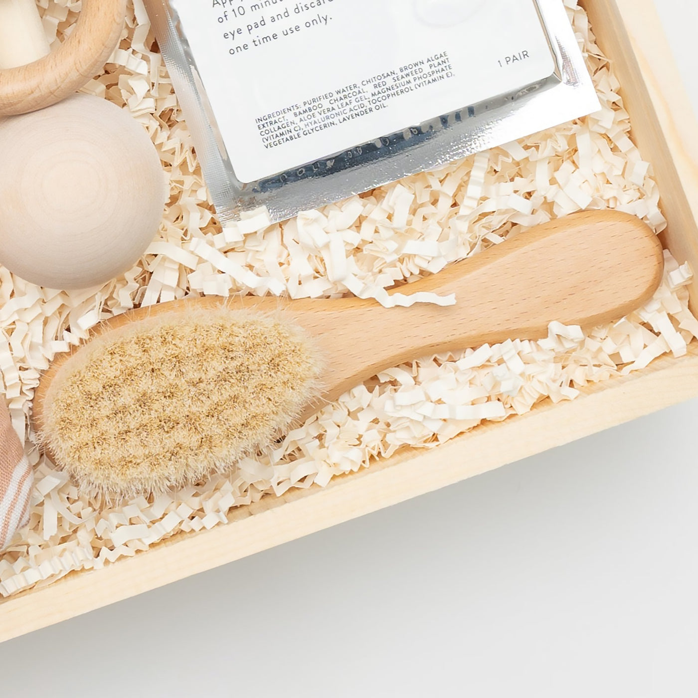 Celebrate the arrival of a new baby with this modern, elegant and practical gift box. Close up of Soft Baby Hair Brush