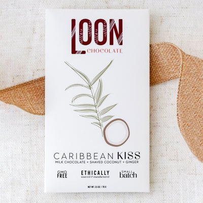 Help new home dwellers settle in with this beautifully refreshing gift box. Close up of  Caribbean Kiss Chocolate Bar