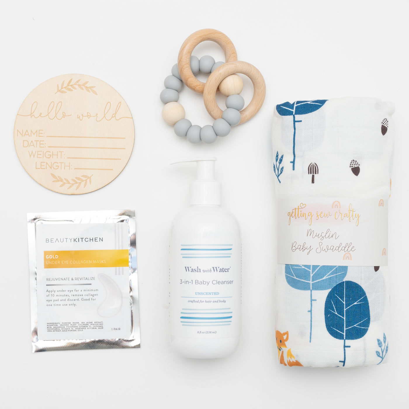 Celebrate the milestone of a new baby (and mom!) in your life with this thoughtful and elegant gift box. Items: Swaddle Blanket, Teething ring, Fragrance Free Baby Cleanser, Eye Gels for Mom, Birth Announcement Wood Disc