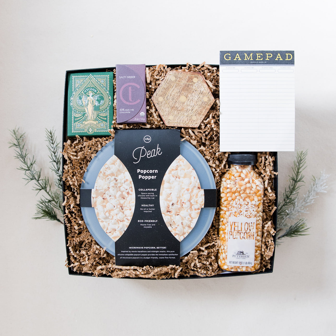 A clever and playful gift to help foster connection at home. This gift box includes all the makings of an amazing game night!