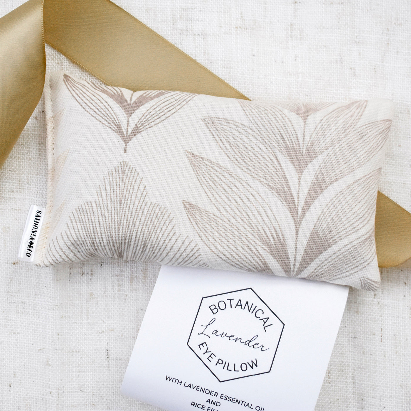 Enjoy this carefully curated gift box with all the makings for an unforgettable self-care day or night. Close up of Weighted Botanical Lavender Eye Pillow