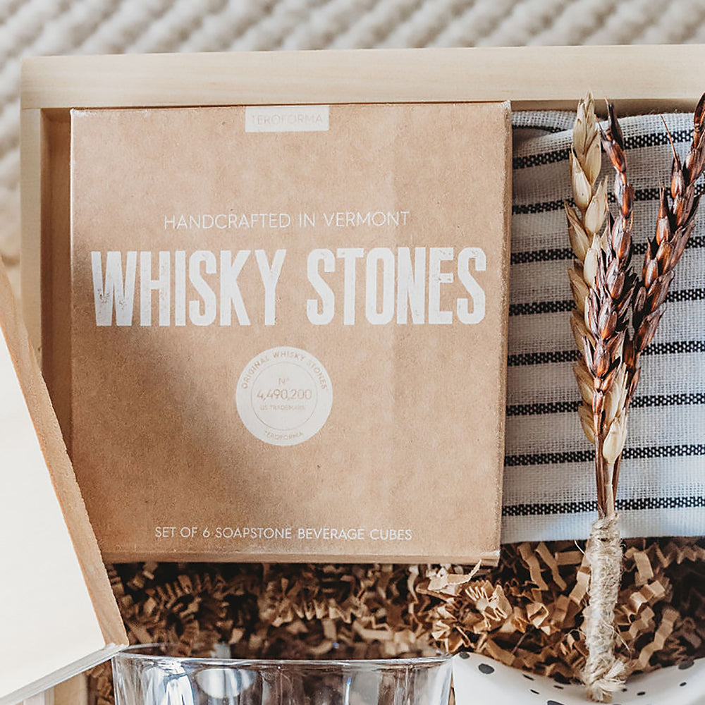 All the ingredients for a sophisticated nightcap. This gift box combines gourmet treats, specialty cocktail inspired contents, and a splash of fun for a refined night ahead. Close up of Handcrafted Whiskey Stones