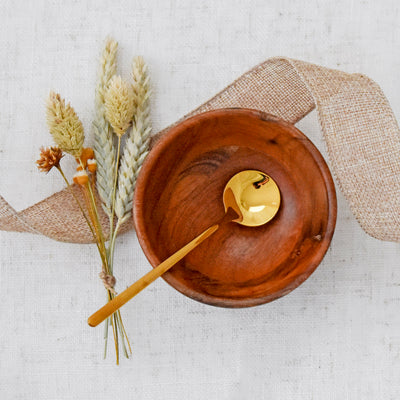 Encourage the break from reality to enjoy some sweet treats and a cup of joe. Close up of Wooden Pinch Bowl and Gold Stirring Spoon