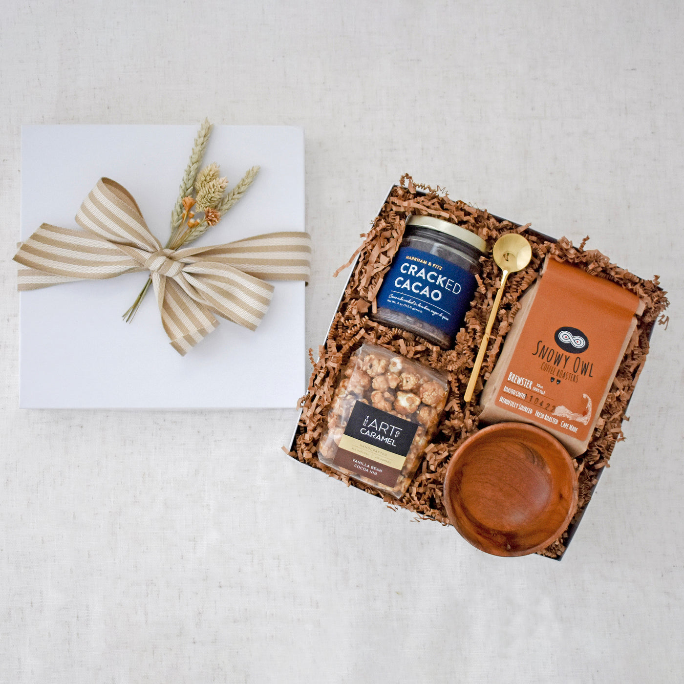 Encourage the break from reality to enjoy some sweet treats and a cup of joe. This gift basket includes: Cracked Cacao, Brewster Coffee, Vanilla Bean Cocoa Nib Popcorn, Wooden Pinch Bowl, Gold Stirring Spoon