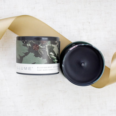 Celebrate the professional milestones and encourage perseverance for all things that lie ahead. Close up of Blackberry Absinthe Candle