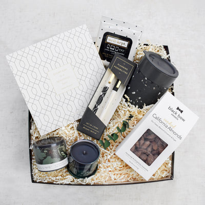 Celebrate the professional milestones and encourage perseverance for all things that lie ahead. This large 2 pc black gift box contains: Daily Planner Pad, Pen Set, Ceramic Mug, Screen Cleansing Towelettes, Blackberry Absinthe Candle, and California Candied Almonds.